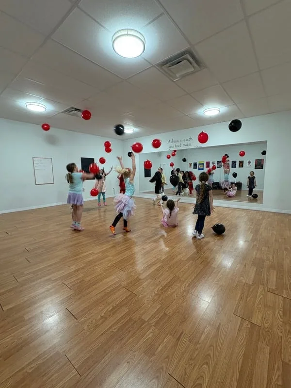 Kids celebrating at the studio with balloons
